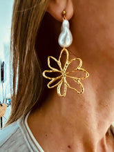 Load image into Gallery viewer, Turn heads with these romantic stainless steel and acrylic flower pearl earrings. Featuring an eye-catching, irregular artificial pearl as the focal point, these statement earrings are complemented by delicate flower contours that gracefully dangle below. A perfect blend of elegance and charm, they add a bold yet feminine touch to any outfit.