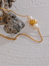 Load image into Gallery viewer, Elevate your style with this natural pearl and stainless steel beaded bracelet, a perfect blend of vintage charm and modern elegance. Featuring luminous natural pearls and gold-colored stainless steel beads, this piece adds a sophisticated touch to any outfit. Durable and timeless, it’s a versatile accessory that can be worn alone or stacked, making it a perfect gift for any stylish woman.