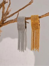 Load image into Gallery viewer, Make a bold statement with this stainless steel chain tassel finger ring, featuring an eye-catching adjustable design in both gold and silver 18K plated finishes. Crafted from high-quality stainless steel, this stylish ring combines elegance with modern charm. The delicate chain tassel detail adds a unique touch, making it a perfect accessory for any fashion-forward jewelry lover. Ideal for both casual and special occasions!