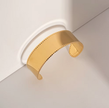 Load image into Gallery viewer, Sleek, modern, and effortlessly stylish, this wide-face open bangle is a must-have accessory for any jewelry collection. Crafted from high-quality stainless steel, it’s waterproof, durable, and designed for all-day comfort. With its smooth, minimalist design, this bracelet adds a touch of elegance to any outfit—perfect for everyday wear or as a thoughtful gift!