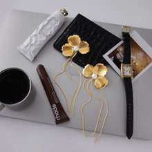 Load image into Gallery viewer, Add a touch of romantic elegance to your look with these acrylic pearl tassel earrings, designed with delicate leaves and floral accents for a timeless, feminine style. Featuring lightweight acrylic pearls and graceful tassel details, these earrings are crafted with durable stainless steel stud posts for comfort and long-lasting wear. Perfect for weddings, parties, or everyday outfits, they blend modern charm with classic sophistication. An ideal accessory for women who love elegant statement earrings, flor
