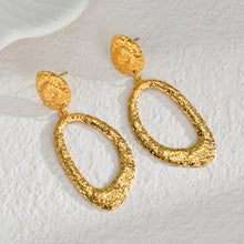Load image into Gallery viewer, Embrace timeless elegance with these French retro-inspired earrings, featuring irregular oval pendants gracefully hanging from small hammered circles. Crafted from high-quality stainless steel, their unique design exudes romance and sophistication. Perfect for weddings, special occasions, or everyday charm, these earrings make a stylish and thoughtful gift.
